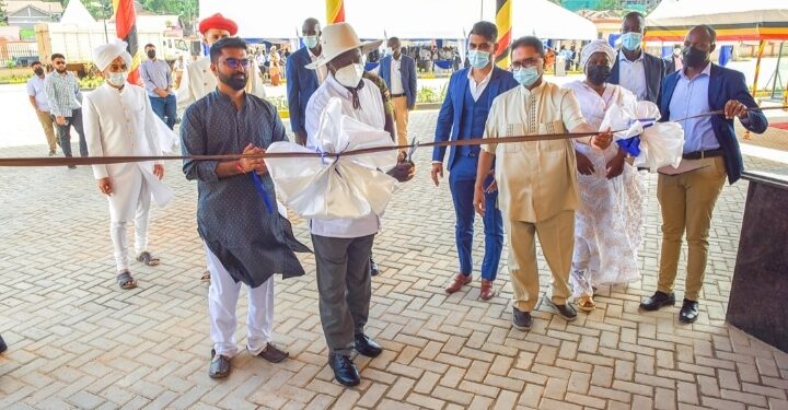 President Yoweri Museveni cuts the tape as a symbol that the school as been opened During the grand opening of the Shree Sahajanand School in Bukoto, Kampala on the 3rd December 2022. Photo by PPU/Tony Rujuta.
