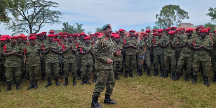 Gen. Kavuma while chanting with military Police officers