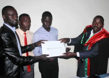 Magufuri while recieving the petition from the leaders of students