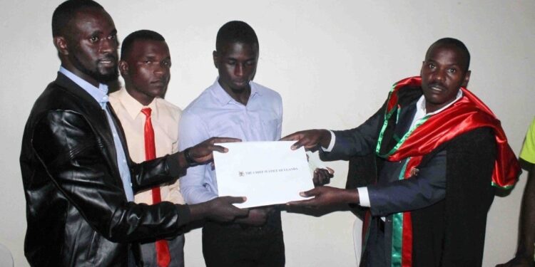 Magufuri while recieving the petition from the leaders of students