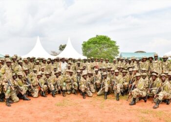 UPDF solidiers pose for a photo after completing their Tier II Course at Fort Samora Machel Special Forces School in Kaweweta on Wednesday. (Seated C) is Col JB Asinguza, Director of Training in SFC