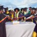 The State House Comptroller Jane Barekye (center) cutting the cake with graduates, local leaders and teachers at the 1st graduation of the Presidential Initiative for Zonal Industrial Parks for Skills Development, Value Addition and Wealth creation at the Lango Zonal Industrial Hub in Lira district on 3rd January 2023. Photo by PPU / Tony Rujuta.