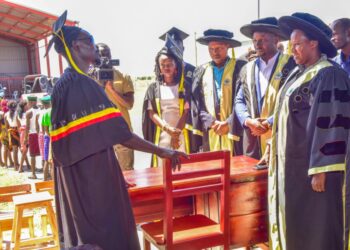 The State House Comptroller Jane Barekye (left) being shown the office furniture by one of the graduate John Lorika from Moroto Municipality during the 1st graduation of the Presidential Initiative for Zonal Industrial Parks for Skills Development, Value Addition and Wealth creation at the Lokitodad Village, Matany Sub County, Napak District 6th  January 2023. Photo by PPU / Tony Rujuta.