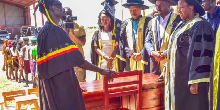 The State House Comptroller Jane Barekye (left) being shown the office furniture by one of the graduate John Lorika from Moroto Municipality during the 1st graduation of the Presidential Initiative for Zonal Industrial Parks for Skills Development, Value Addition and Wealth creation at the Lokitodad Village, Matany Sub County, Napak District 6th  January 2023. Photo by PPU / Tony Rujuta.