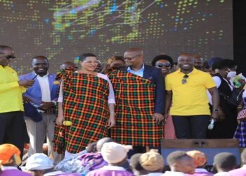 Speaker Anita Among (holding yellow microphone) at the event in Ngariam. On her left is Hon. Moses Magogo and Hon. Peter Ogwang