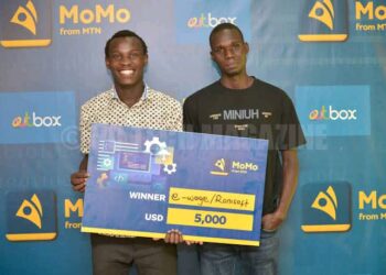 Ronald Akuayo (R) and Ivan Kisa (L)after winning the 2022 MTN MoMo Hackathon