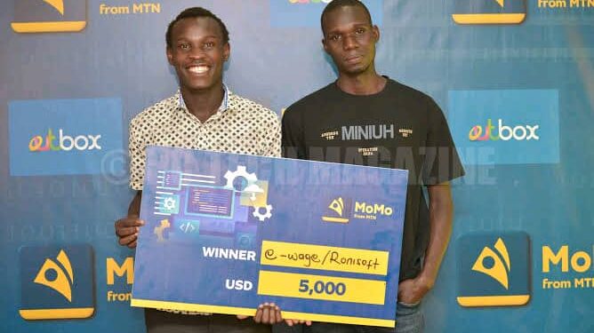 Ronald Akuayo (R) and Ivan Kisa (L)after winning the 2022 MTN MoMo Hackathon