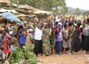 Some of the market women express their excitement after receiving financial support from President Yoweri Museveni