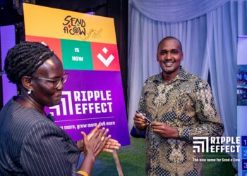 Minister Frank Tumwebaze launches the new name. Looking on is Peninah Kasule, the Board Chair of Ripple Effect