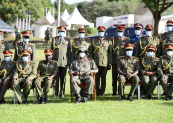 President Yoweri Museveni in a group photo with the NDC-U graduands