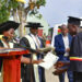 State House Comptroller Jane Barekye (R) hands over a certificate to one of the best students at the Mengo Zonal Industrial Hub in Kayunga during a graduation ceremony on Thursday. PPU Photo