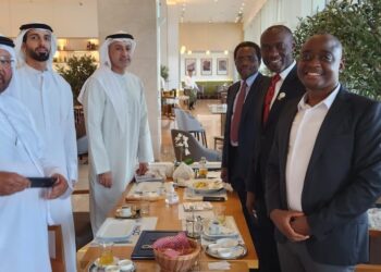 Businessman Ham Kiggundu (right) in UAE