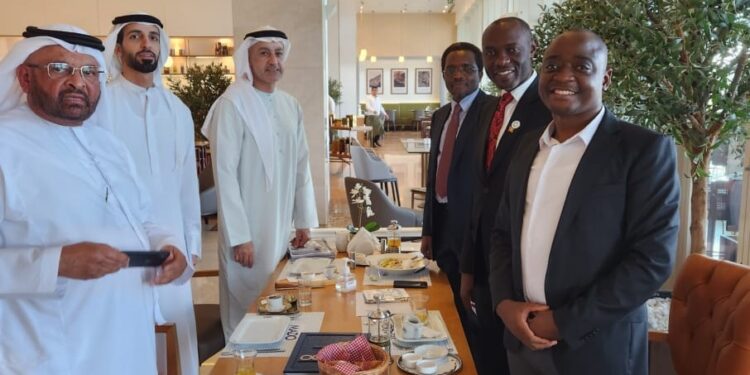 Businessman Ham Kiggundu (right) in UAE