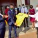 President Yoweri Museveni (right) hands over a Uganda Athletics Federation (UAF) official Jersey T- Skirt to a British sports commentator, television presenter and freelance reporter Robert Joseph Walker (center) in the presence of the Uganda Athletics Federation (UAF) President Dominic Otuchet (left) after a meeting with the Uganda Tourism Board (UTB) members at the State House Entebbe on 8th February 2023. Photo by PPU/ Tony Rujuta.