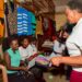 Presidential Initiative on skilling the Girl/Boy Child head of the project Faith Katana Mirembe (right)  interacting with knitting students as they show the skills attained in the course this was during the Presidential Initiative on skilling the Girl/Boy Child project 7th intake inspection of the skills of the students as they show case their work at Wandegeya Centre on 22nd February 2023. Photo by PPU/Tony Rujuta.