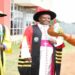 A student (right) leads the Deputy Speaker, Hon. Thomas Tayebwa (left) and the Chancellor of the University of Saint Joseph, Mbarara City, His Grace, Lambert Bainomugisha, to the 2nd graduation ceremony on Saturday, 18 February 2023