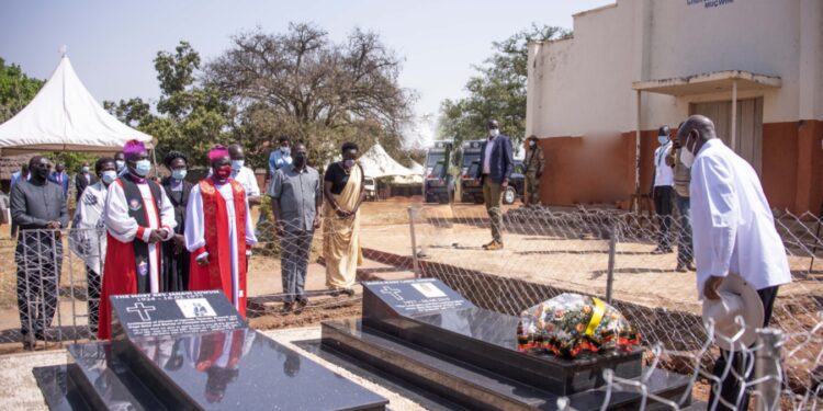 President Yoweri Museveni laying a wreath on the grave of Archbishop Janani Luwum