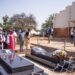 President Yoweri Museveni laying a wreath on the grave of Archbishop Janani Luwum