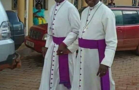Archbishop Kazimba flanked by Ntagali at the concecretion ceremony of the new Bishop for North Karamoja last week