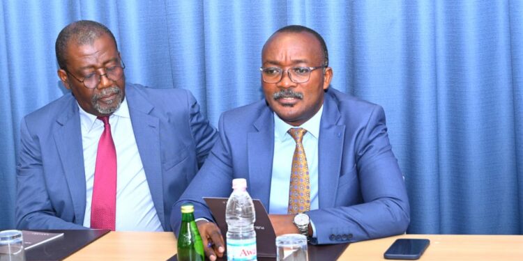 Dr Silver Mugisha (right)