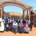 Minister Babalanda in a group photo with the Management of Jinja School of Nursing and Midwifery