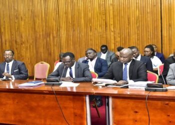 Former NSSF MD, Richard Byarugaba (L) appearing before the committee investigating the fund