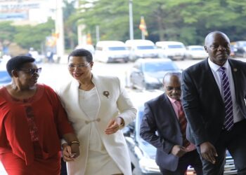 Speaker Anita Among (C) is welcomed by former Member of Parliament, Miria Matembe. On the Right is SACCO Chairperson, Hon. Robert Migadde