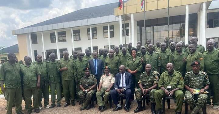 Minister Kyofatogabye,  Manifesto Director Mr. Bashaasha and other government officials in a group photo with district leaders from Greater Northern Uganda region