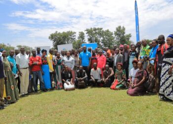 SACCO leaders and Parish Chiefs from Kayunga District pose for a group photo after the PDM training at Kayonza Primary School