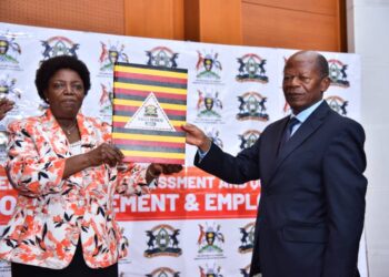 UNEB Chairperson Prof. Mary Okwakol and the Minister of State for Higher Education Dr JC Muyingo during the release of UACE2022 results