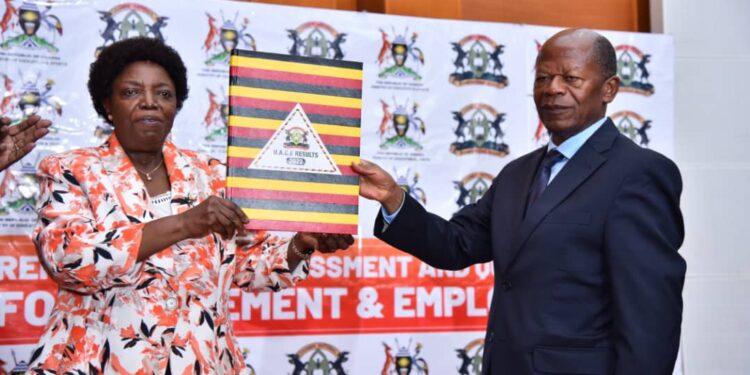 UNEB Chairperson Prof. Mary Okwakol and the Minister of State for Higher Education Dr JC Muyingo during the release of UACE2022 results