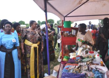 Minister Babalanda inspecting some of the products displayed by women during the event