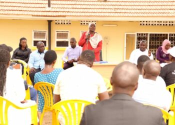 Hajjat Hadijjah Namyalo in red while delivering her message to coordinators at office Kyambogo