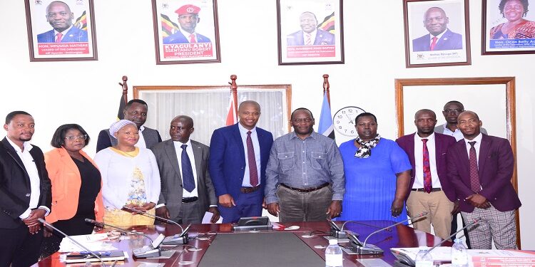 Mpuuga (5th L) with the visiting members of the South African Party after the meeting