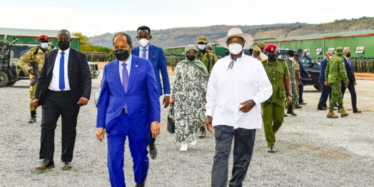 President Museveni and President Hassan Sheikh Mohamud of Somalia arrive in Butiaba to pass out Somali trainees on Sunday. PPU Photo
