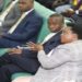 Minister Betty Amongi (R) in the House as the report was presented.