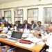 Hon. Nambooze (R) chairing the committee where UNRA Ed, Kagina (in black and white) appeared
