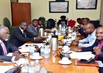 Former REA staff (R) appearing before the committee. One the left is Hon, Eddie Kwizera