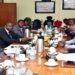 Former REA staff (R) appearing before the committee. One the left is Hon, Eddie Kwizera