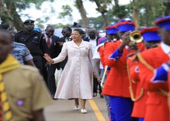Speaker Among (C) in a procession shortly after her arrival at Namilyango College