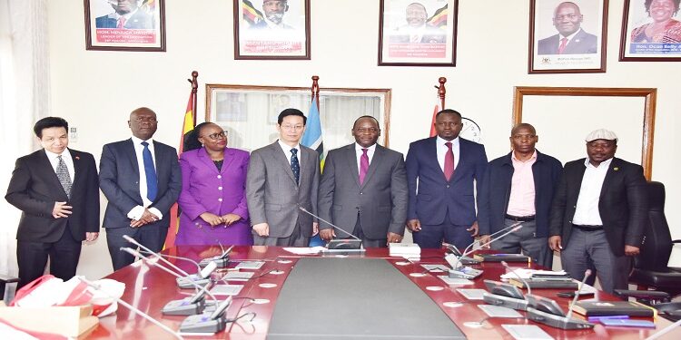 Hon. Mpuuga and Zhang Lizhong (C) with Opposition MPs and officiala from the Chinese Embassy after the meeting