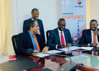 Mr. Tsehay Shiferaw, the Awash Bank Chief Executive Officer (left) and Mr. Mathias Kamugasho, the Service Cops Managing Director exchange signed MoUs to roll out Service Cops’ instant micro-loans solution and a portfolio of other digital finance products.