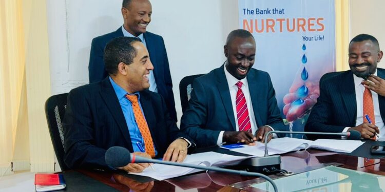 Mr. Tsehay Shiferaw, the Awash Bank Chief Executive Officer (left) and Mr. Mathias Kamugasho, the Service Cops Managing Director exchange signed MoUs to roll out Service Cops’ instant micro-loans solution and a portfolio of other digital finance products.