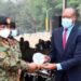 Mbarara City North MP Robert Rukaari receives a plaque from the Chief of Defence Forces at the recent Tarehe Sita celebrations in Mbarara. The UPDF recognised Rukaari for organising the celebrations on February 4.