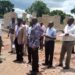 Bangu and other leaders monitoring a school site in Bumanha, Kaliro district