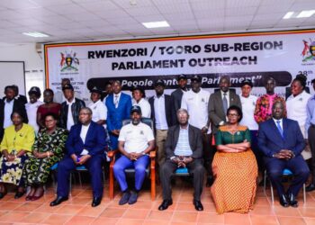 Tayebwa (C) with the local leaders attending the outreach in Fort Portal