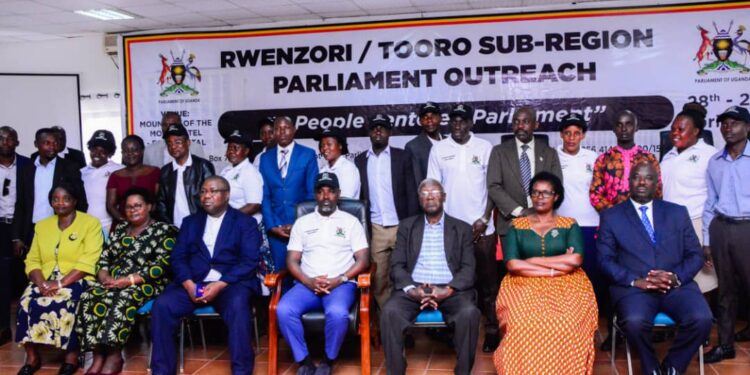 Tayebwa (C) with the local leaders attending the outreach in Fort Portal