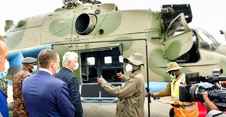 President Museveni chats with Valari Copcin after commissioning into flight the first Soviet Union-Russian type helicopter overhauled in Africa by Pro Heli International Services at Nakasongola. PPU Photo
