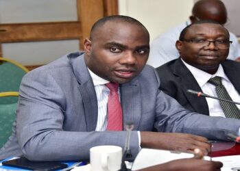 Minister Musasizi (L) with the Accountant General, Lawrence Semakula before the Committee on Finance