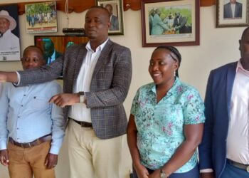 Kayunga LC 5 Chairman  Andrew Muwonge centre and Margret Nakavubu after the preparatory meeting of the ceremony